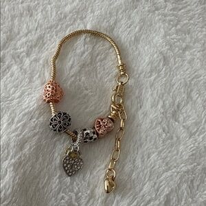 Chic Gold Bracelet with Pink and Silver Charms